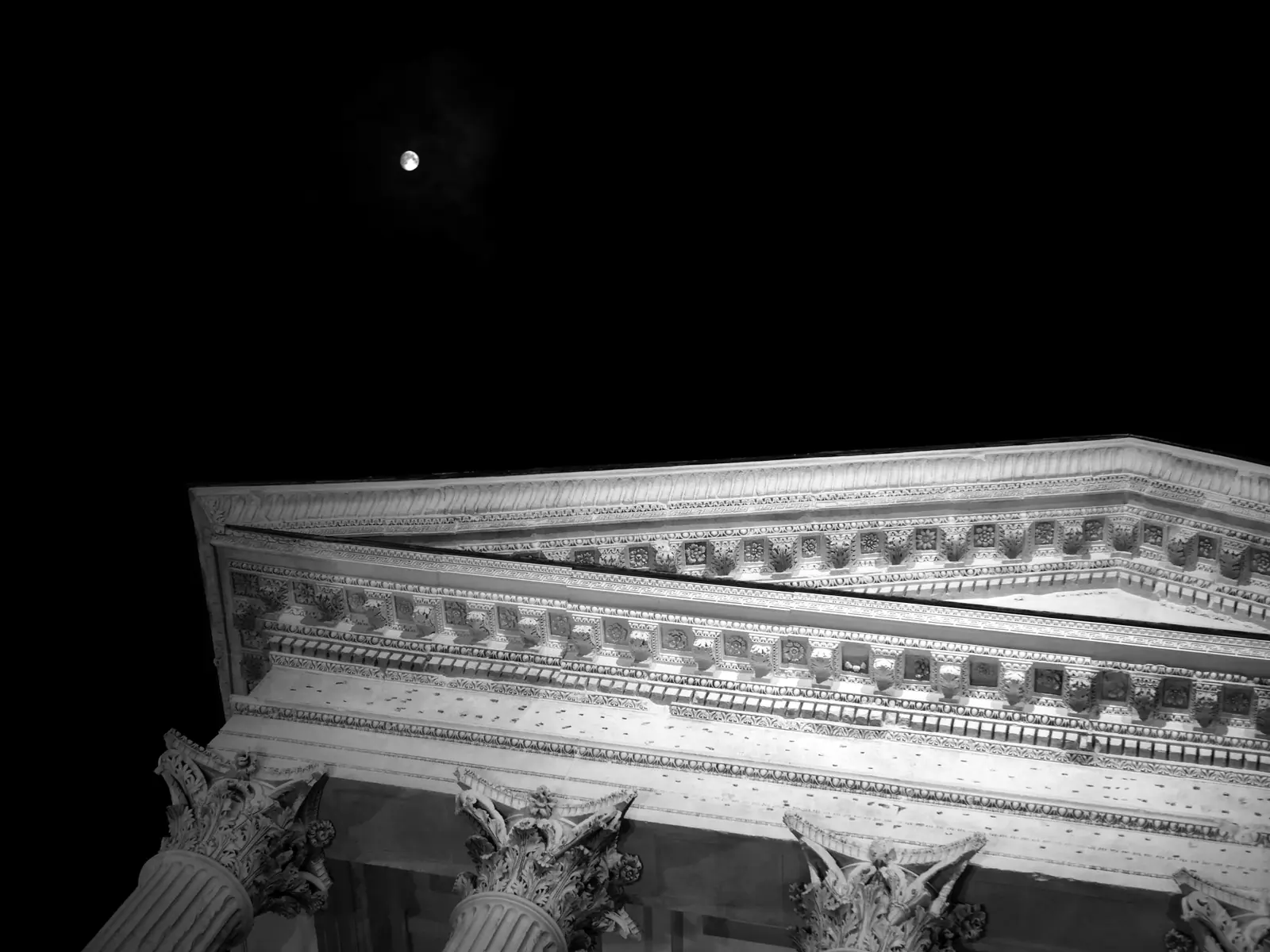 Classical stone columns at night